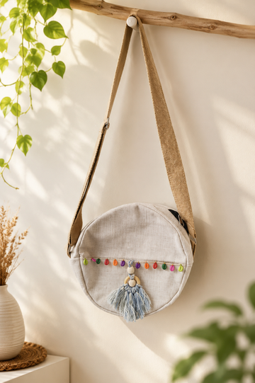 Handcrafted Off-White Round Jute Sling Bag with Tassel & Multicolor Bead Detailing – Eco-Friendly Crossbody Bag